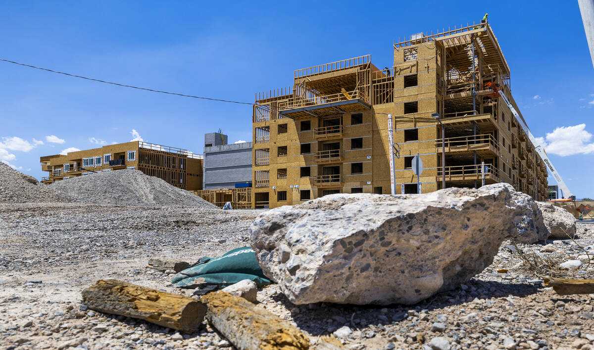 Construction continue on a new apartment building next to the existing Tanager apartment comple ...