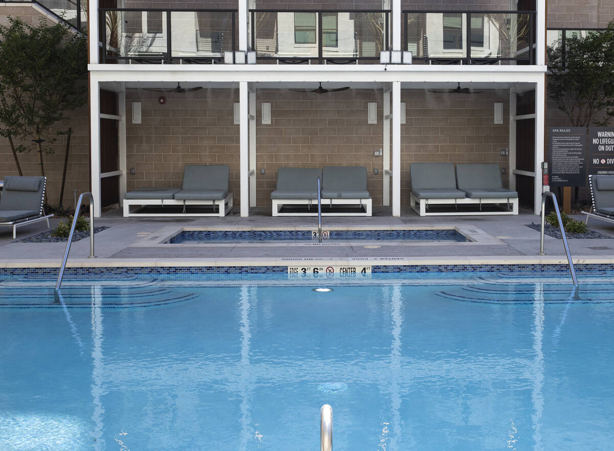 Swimming pool area at Auric Symphony Park, the first luxury multifamily residential community a ...