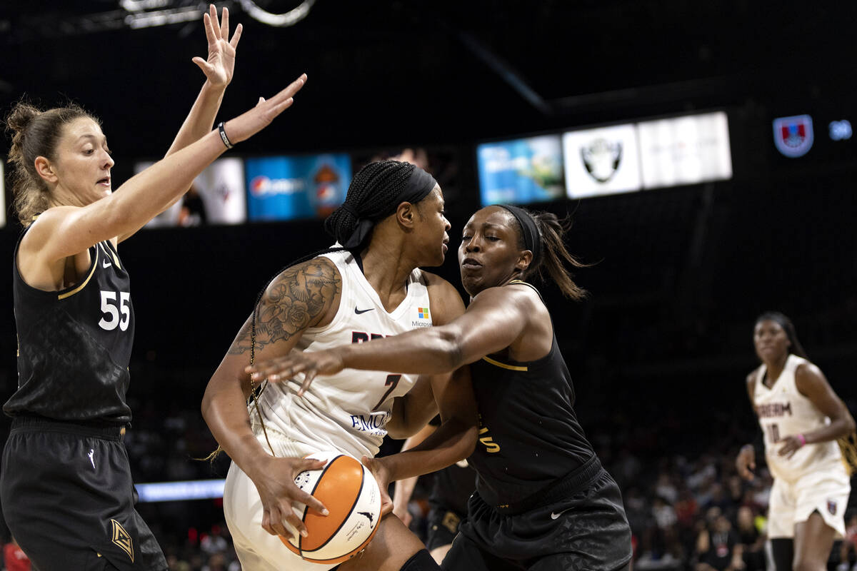 Las Vegas Aces guard Chelsea Gray (12) defends against Atlanta Dream center Kia Vaughn (7) whil ...