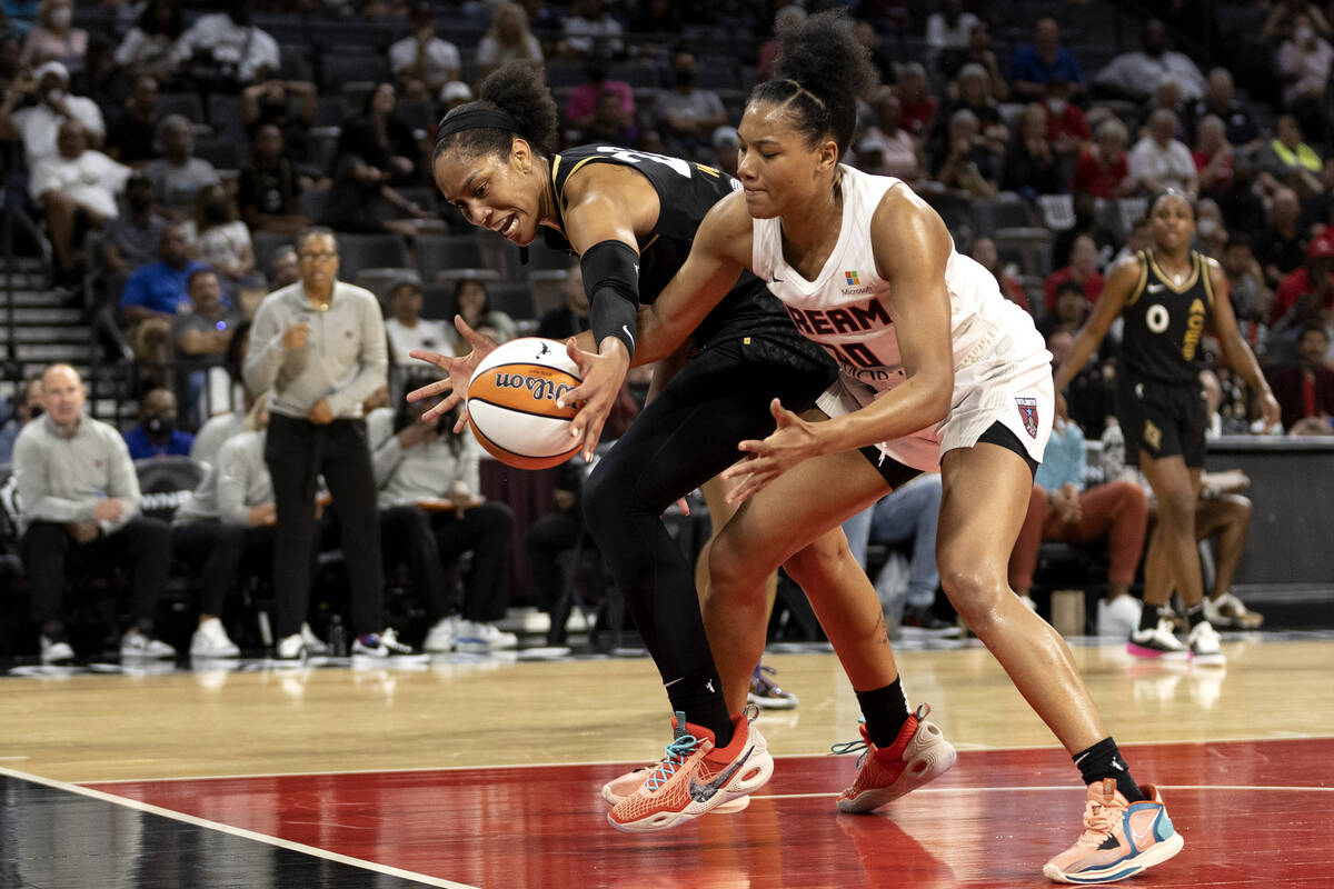 Las Vegas Aces forward A'ja Wilson (22) and Atlanta Dream forward Naz Hillmon (00) compete for ...