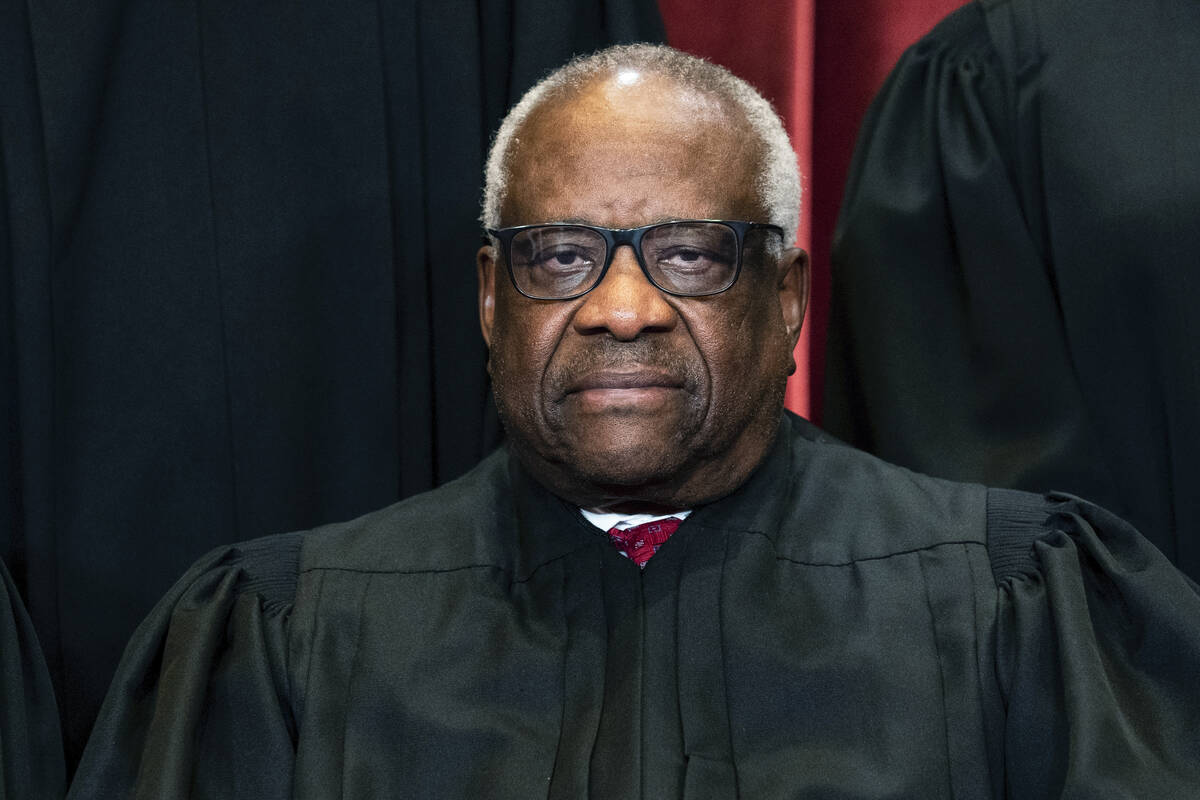 FILE - Supreme Court Justice Clarence Thomas sits during a group photo at the Supreme Court in ...