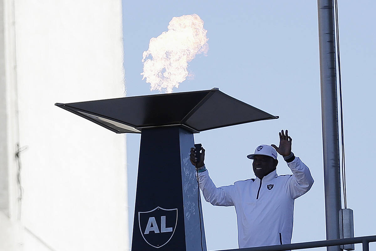 FILE - In this Nov. 4, 2012, file photo former Oakland Raiders wide receiver Cliff Branch light ...