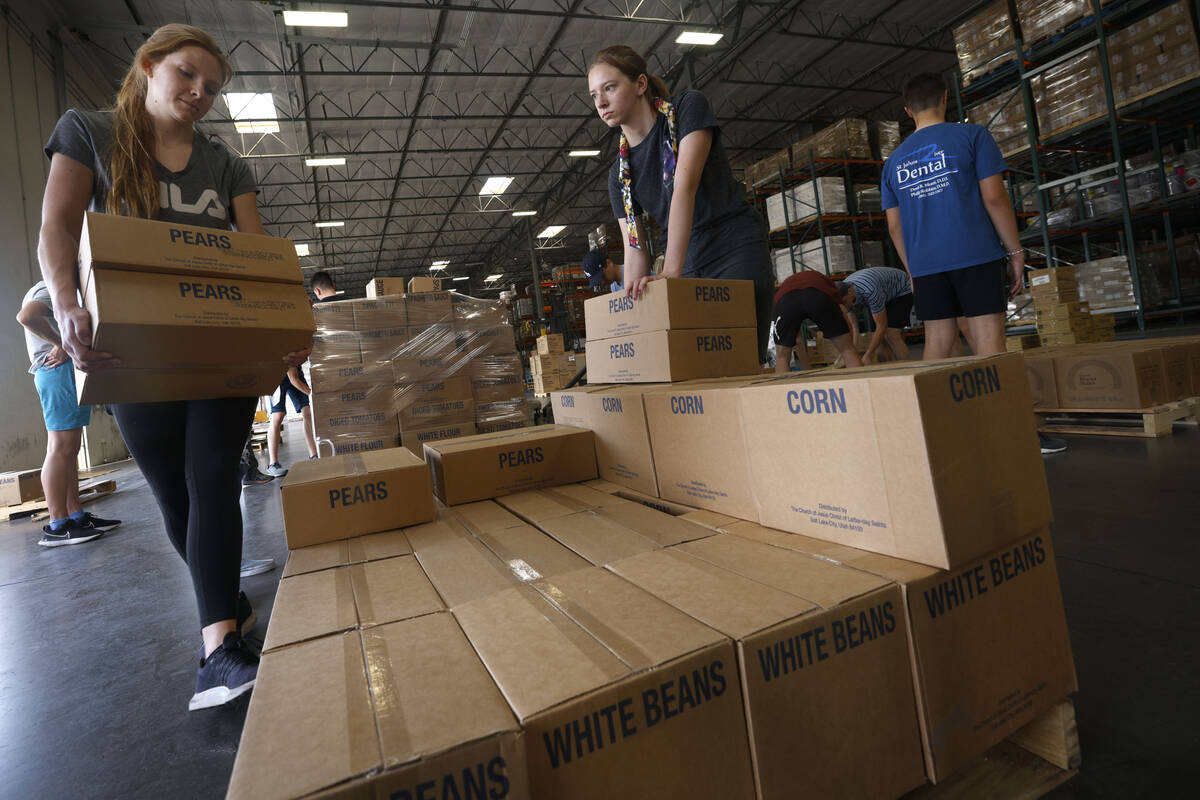 Volunteers from The Church of Jesus Christ of Latter-day Saints,Lauren Stankosky, 24, left, and ...