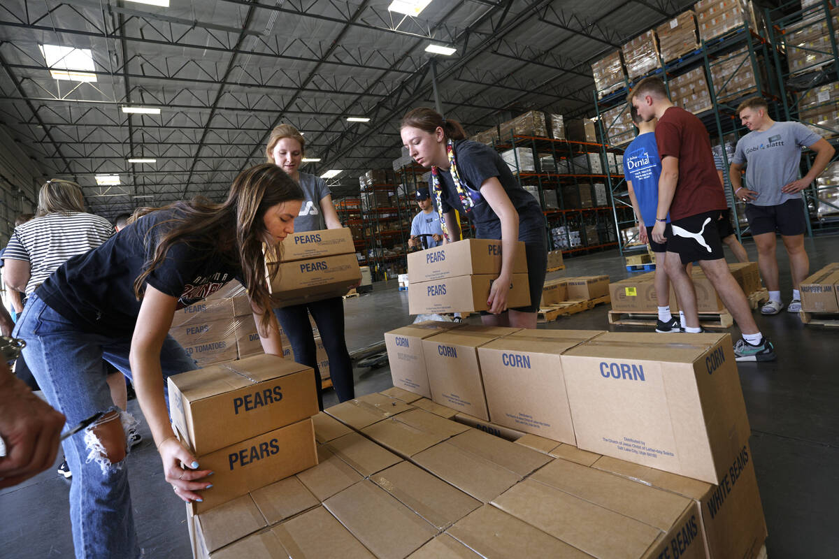 Volunteers from The Church of Jesus Christ of Latter-day Saints, Grace Stankosky, 21, left, her ...