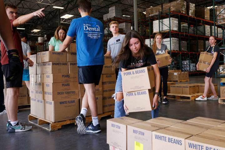 Grace Stankosky, 21, a volunteer from The Church of Jesus Christ of Latter-day Saints, sorts fo ...