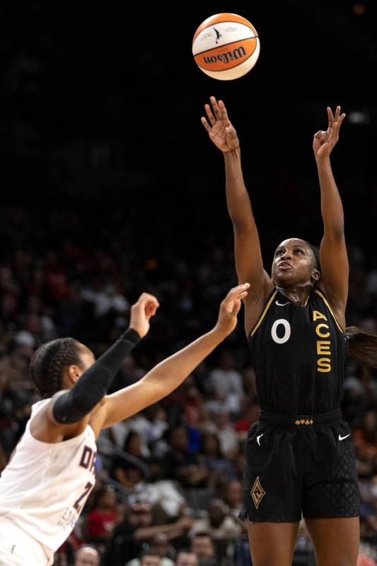 Las Vegas Aces guard Jackie Young (0) shoots against Atlanta Dream guard Asia Durr (23) during ...