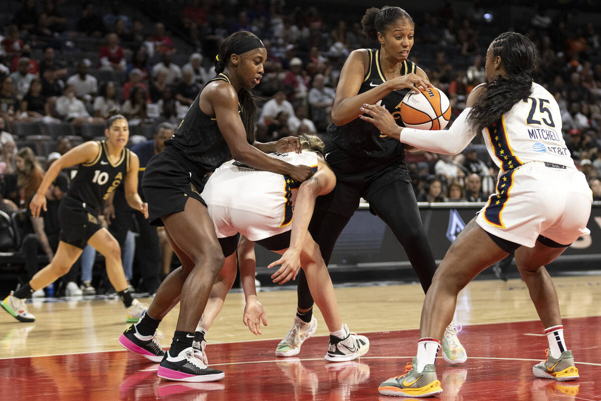 Las Vegas Aces center Iliana Rupert (21) gains control of the ball from Indiana Fever guard Tif ...