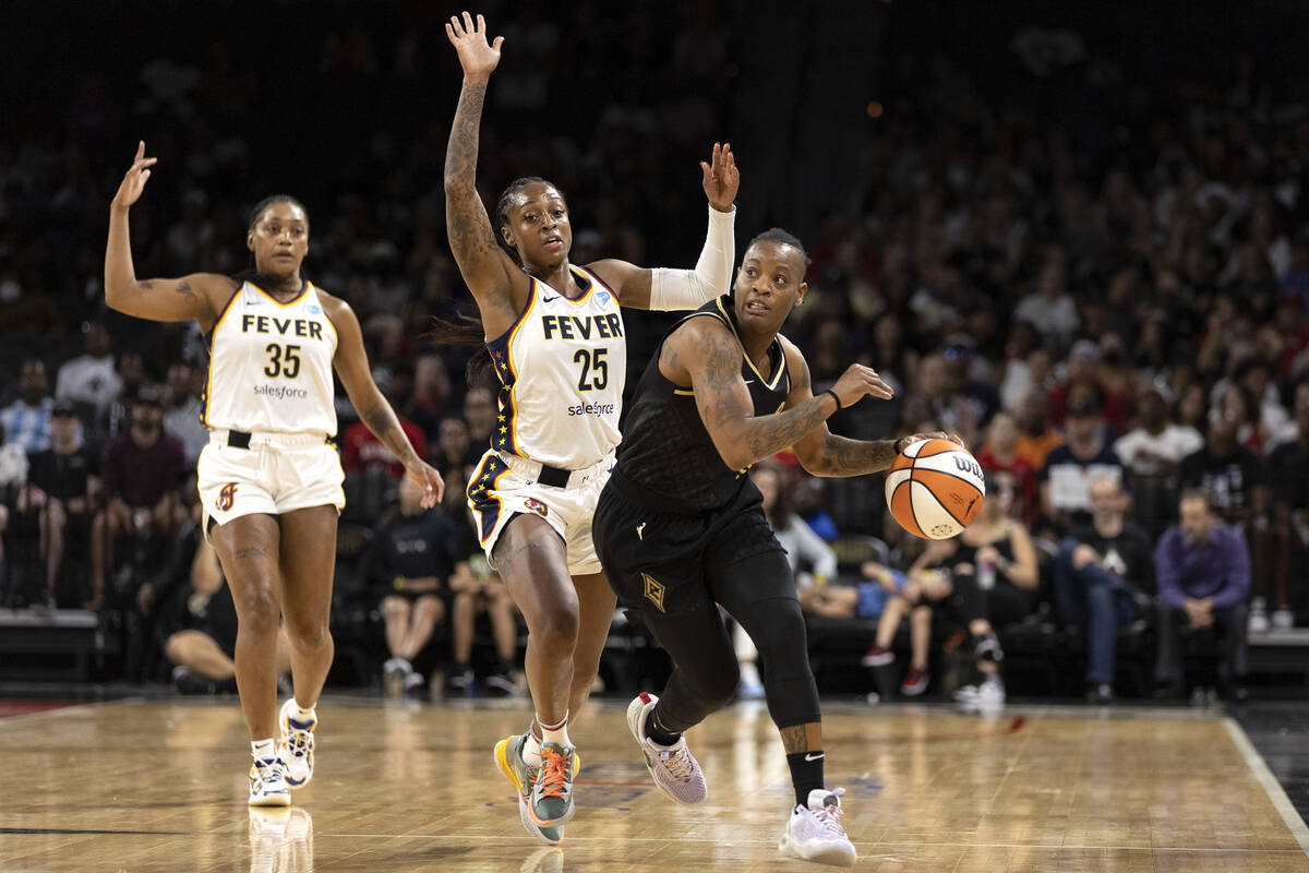 Las Vegas Aces guard Riquna Williams (2) drives up court followed by Indiana Fever guard Tiffan ...