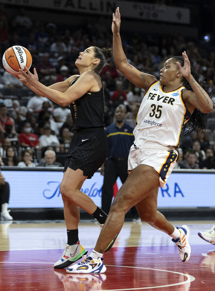 Las Vegas Aces guard Kelsey Plum (10) shoots against Indiana Fever guard Victoria Vivians (35) ...