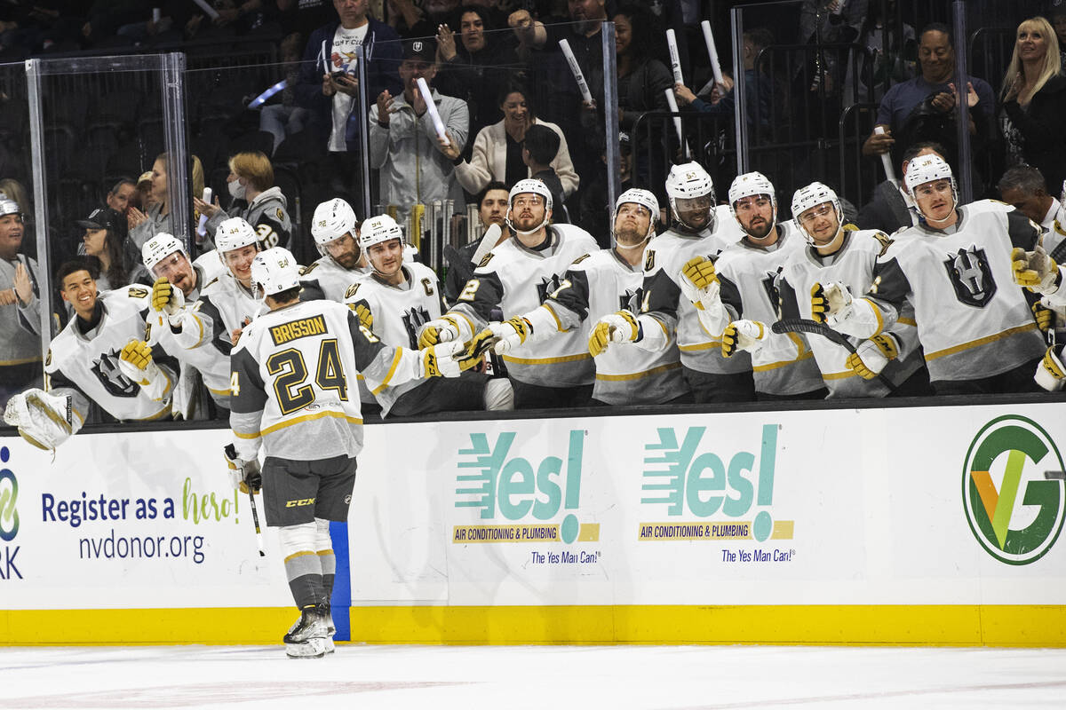 Silver Knights forward Brendan Brisson (24) celebrates with teammates after scoring in the firs ...