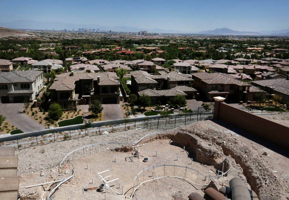 The Las Vegas strip is seen as a swimming pool is under construction in a new house in Southern ...