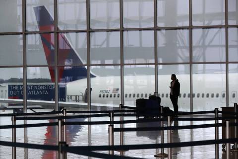 A Delta plane sits at the International Terminal at Atlanta's Hartsfield-Jackson International ...