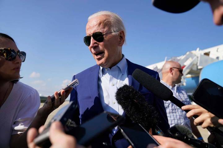 President Joe Biden speaks to members of the media after exiting Air Force One, Wednesday, July ...