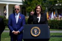 Vice President Kamala Harris speaks as President Joe Biden looks on, during an event to celebra ...