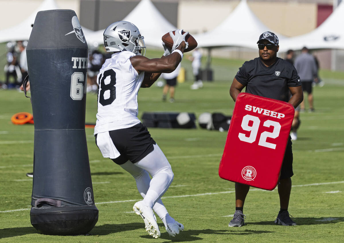 Raiders wide receiver Jordan Veasy (18) catches the ball during team's practice at training cam ...