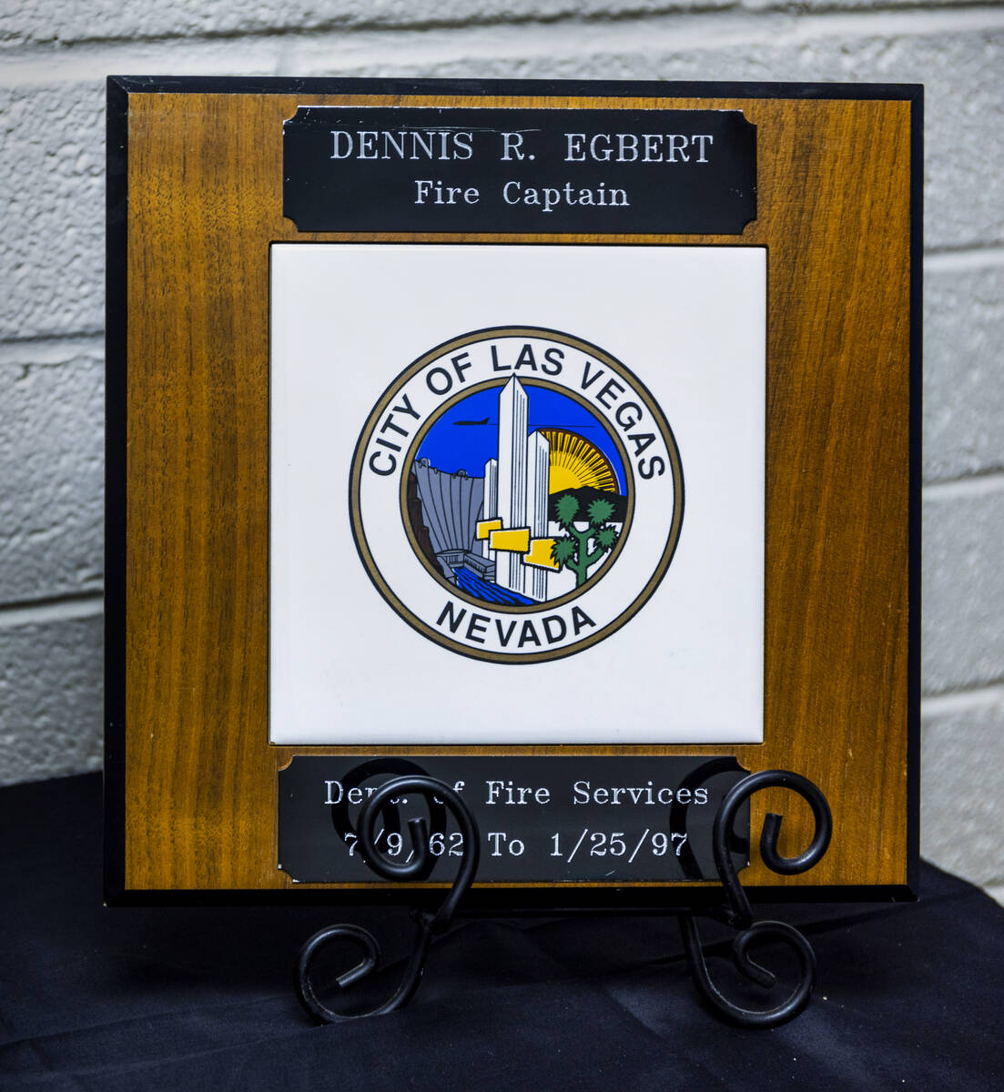 A plaque from Las Vegas Fire & Rescue Capt. Dennis Egbert on display during his funeral at ...