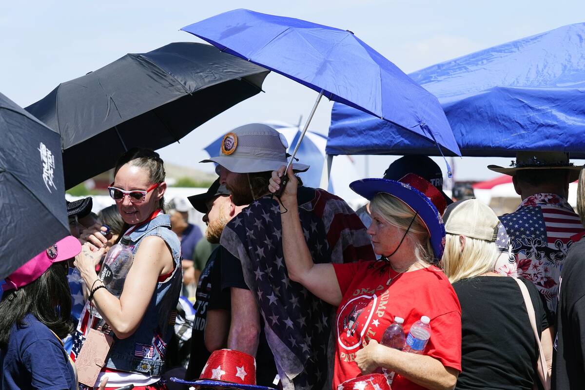 Supporters of former President Donald Trump wait in line hours before the former president is s ...