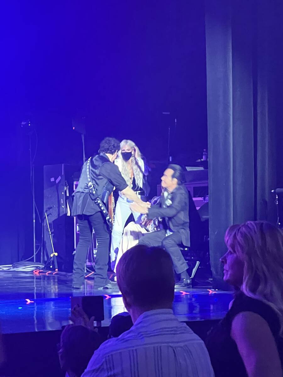 Neal Schon greets Wayne Newton as Michaele Schon looks on Journey's performance at Resorts Worl ...