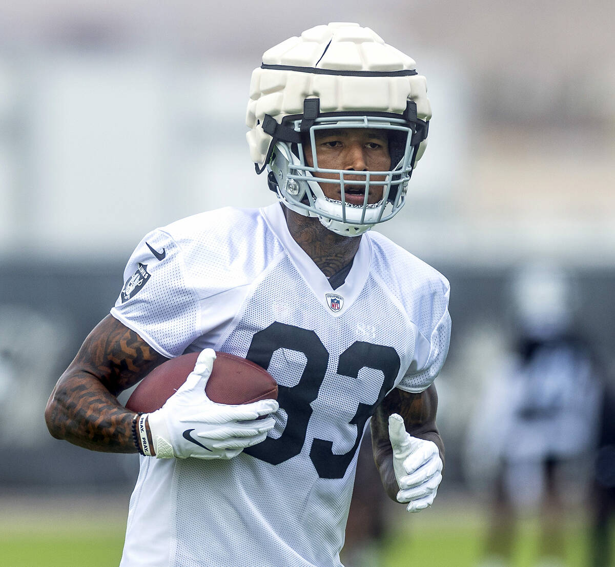 Raiders tight end Darren Waller (83) runs with the ball after a catch during training camp in t ...