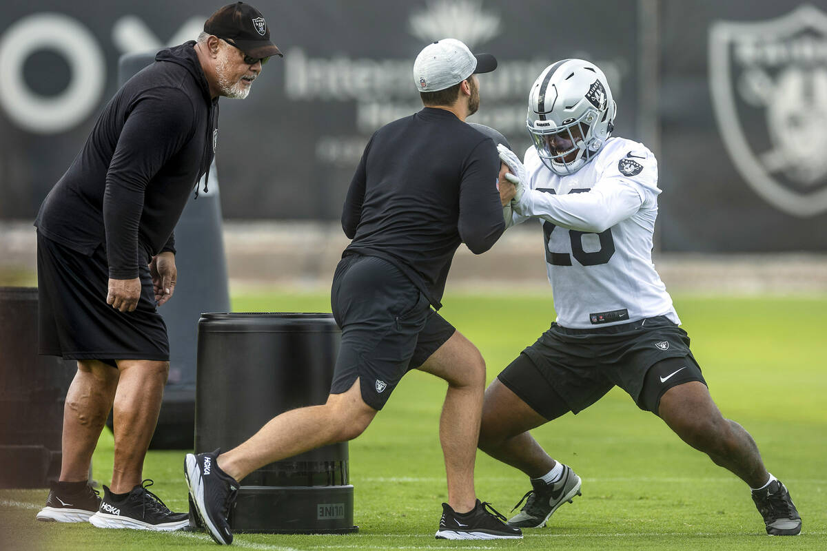 Raiders running back Josh Jacobs (28) runs a blocking drill during training camp in the Interm ...