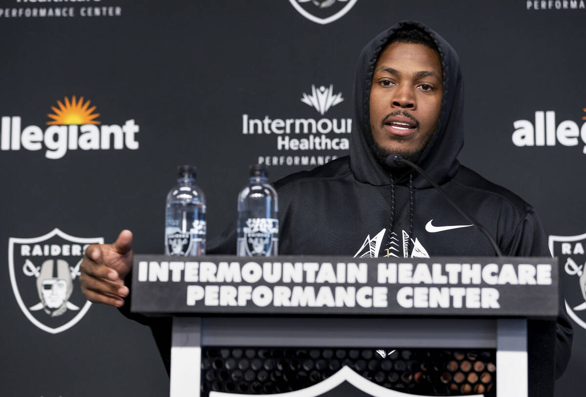 Raiders running back Josh Jacobs (28) talks during a press conference at training camp in the I ...