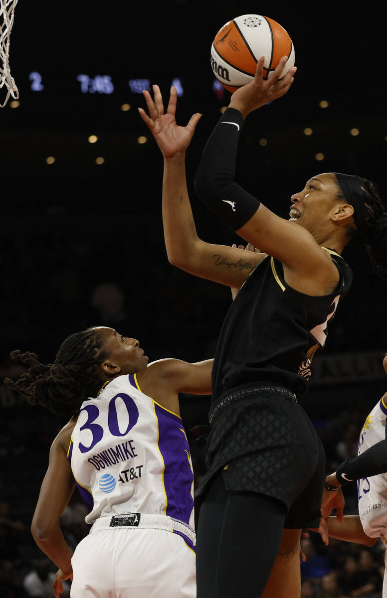 Las Vegas Aces forward A'ja Wilson (22) shoots over Los Angeles Sparks forward Nneka Ogwumike ( ...