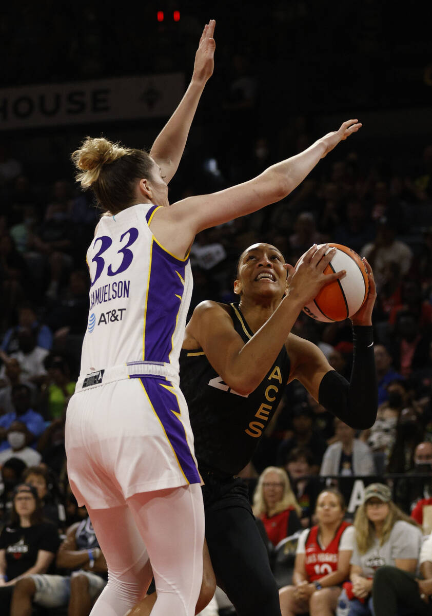 Las Vegas Aces forward A'ja Wilson (22) looks to pass against Los Angeles Sparks forward Katie ...