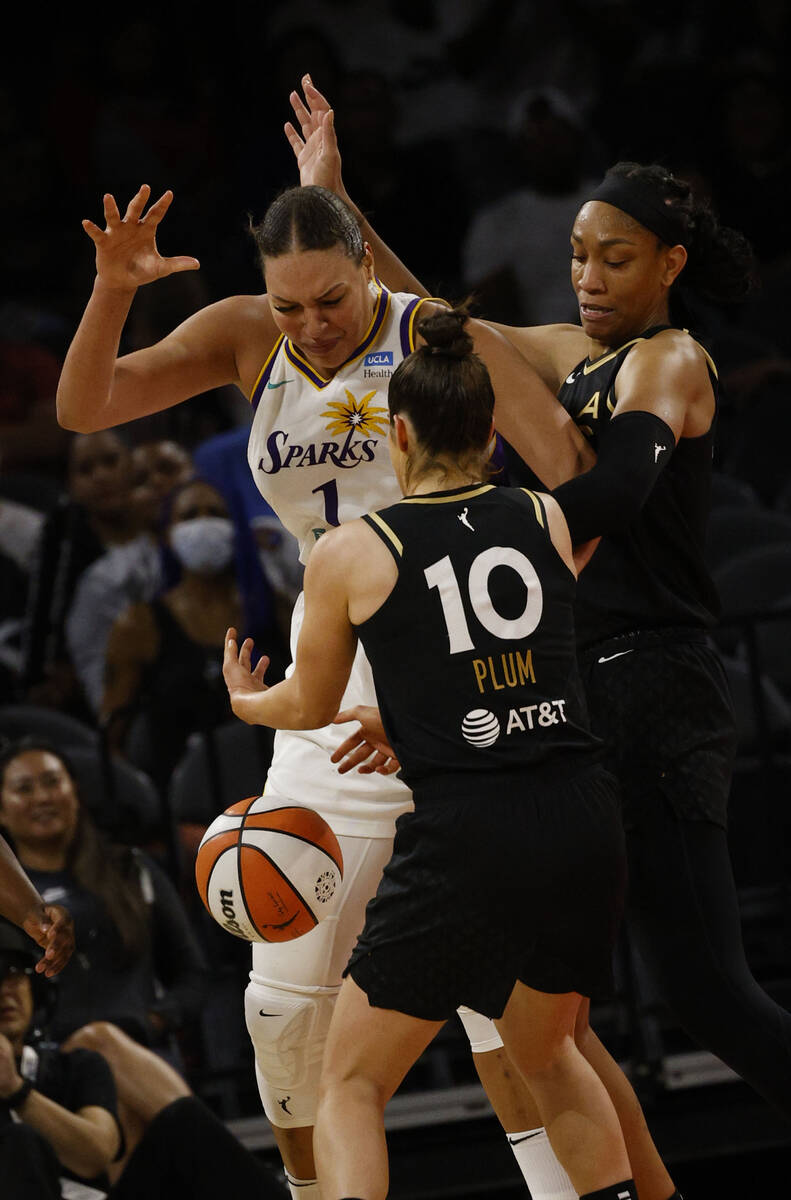 Los Angeles Sparks center Liz Cambage (1) looses a ball against Las Vegas Aces guard Kelsey Plu ...