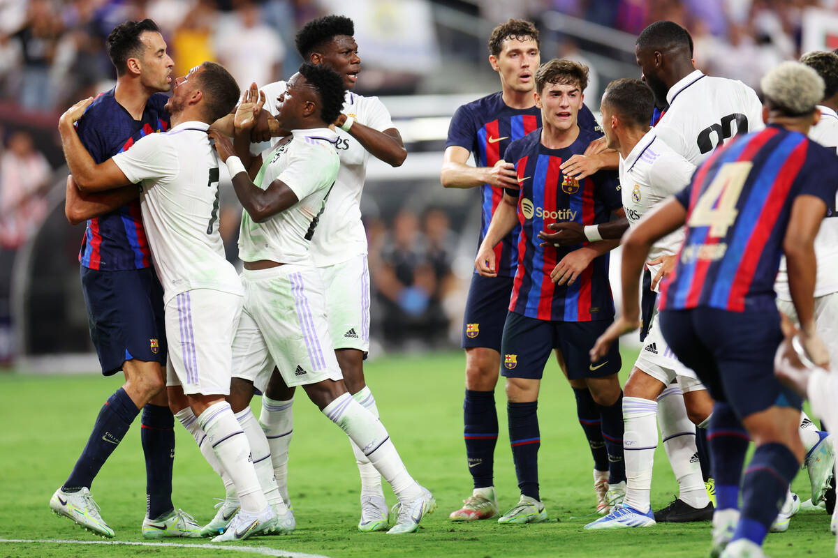 Players from Barcelona and Real Madrid get into a confrontation in the first half during a Cham ...