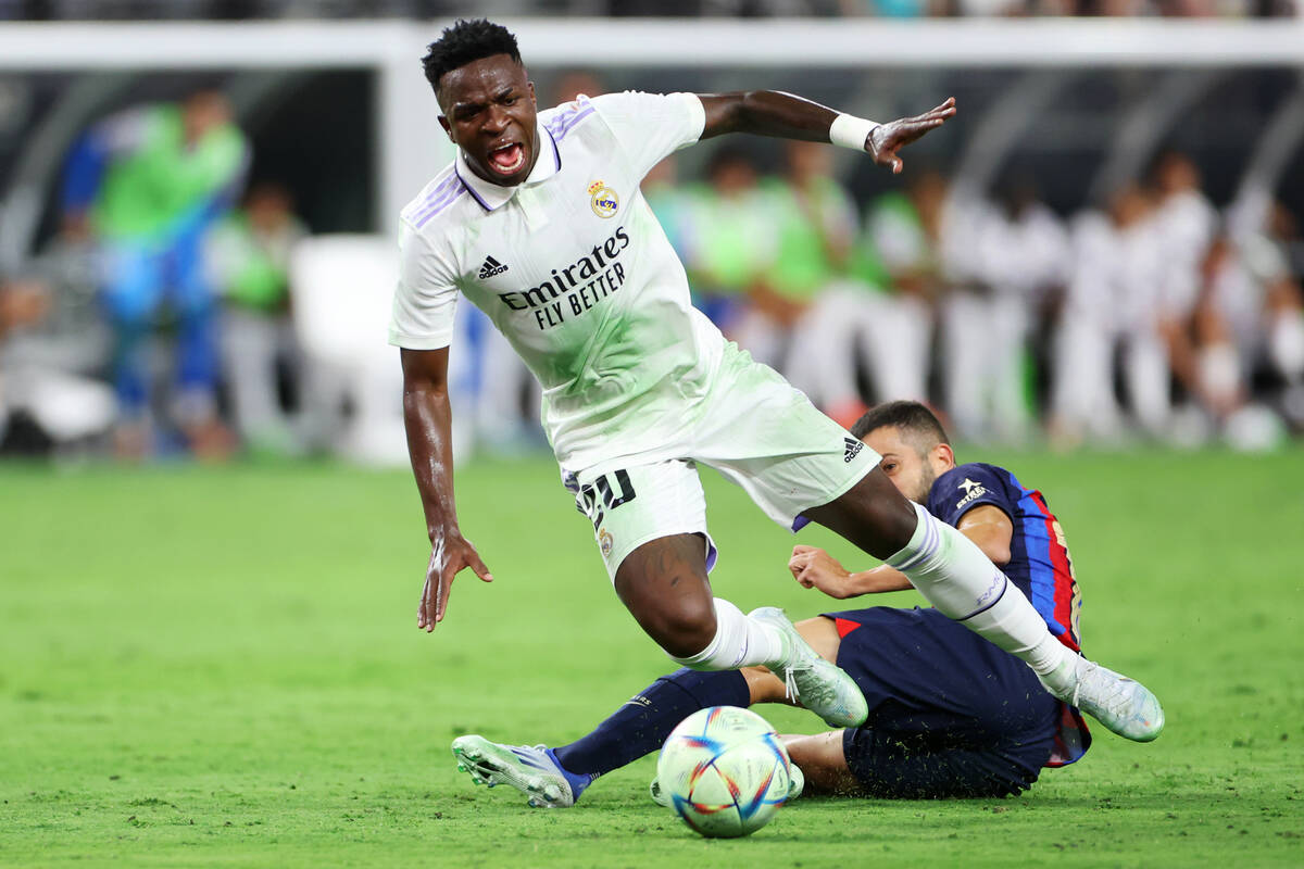 Real Madrid's Antonio Rudiger (22) is fouled by Barcelona's Jordi Alba (18) in the first half o ...
