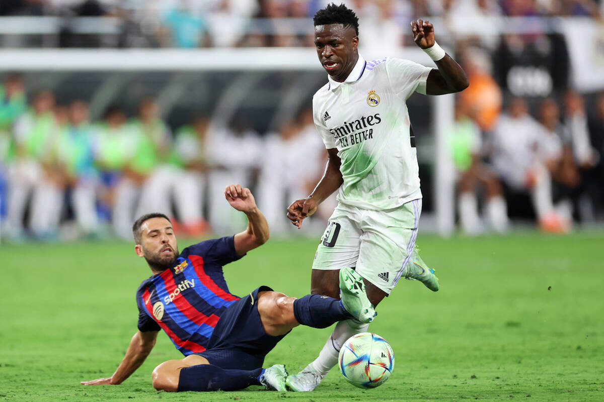 Real Madrid's Antonio Rudiger (22) is fouled by Barcelona's Jordi Alba (18) in the first half o ...
