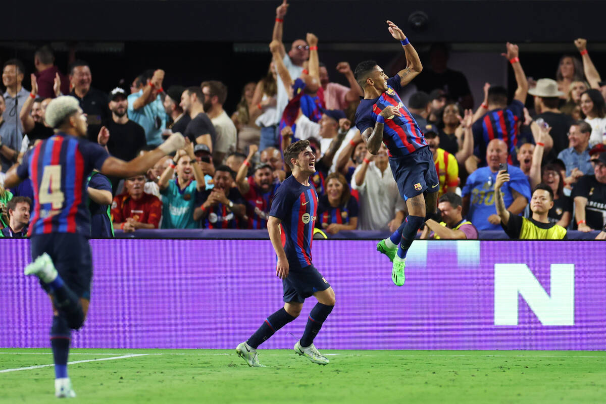 Barcelona's Raphael Dias celebrates his goal in the first half of a Champions Tour soccer game ...