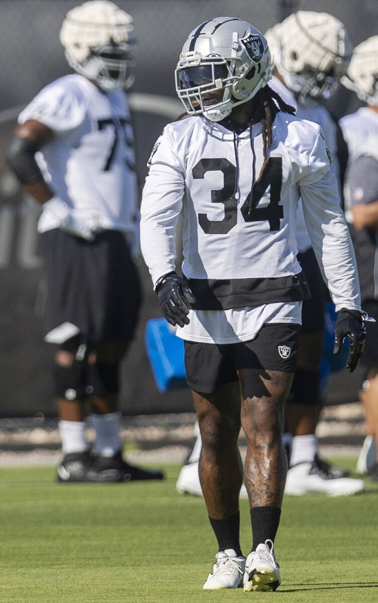 Raiders running back Brandon Bolden (34) walks the field during the team’s training camp ...