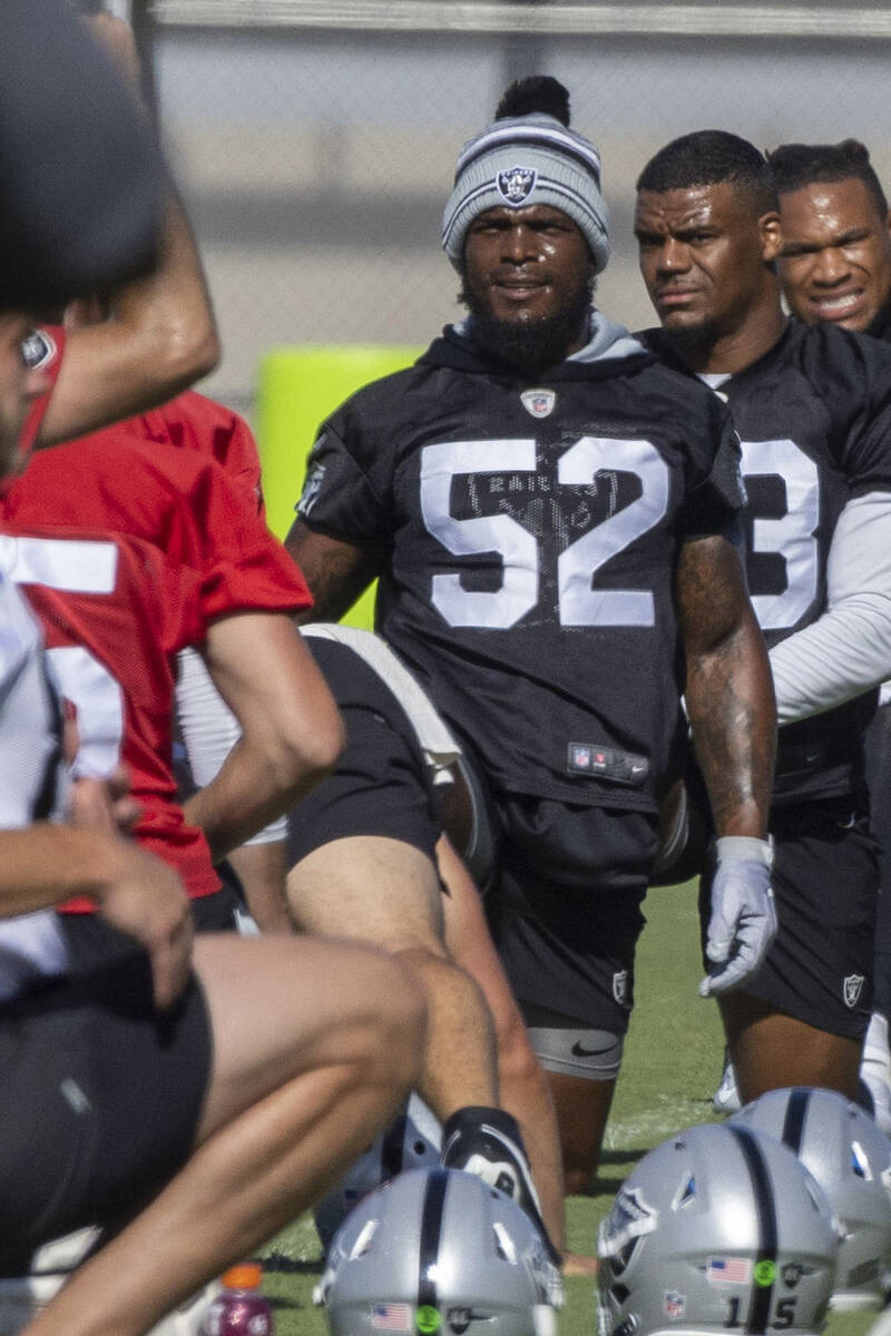 Raiders linebacker Denzel Perryman (52) stretches during the team’s training camp practi ...