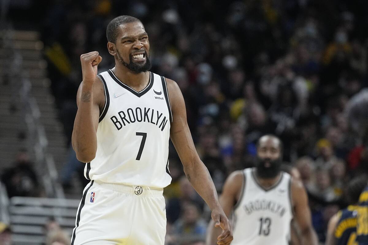 FILE - Brooklyn Nets' Kevin Durant reacts during the second half of an NBA basketball game agai ...