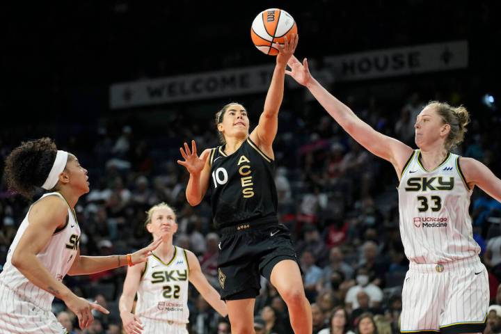 Las Vegas Aces guard Kelsey Plum (10) shoots against Chicago Sky forward Emma Meesseman (33) du ...