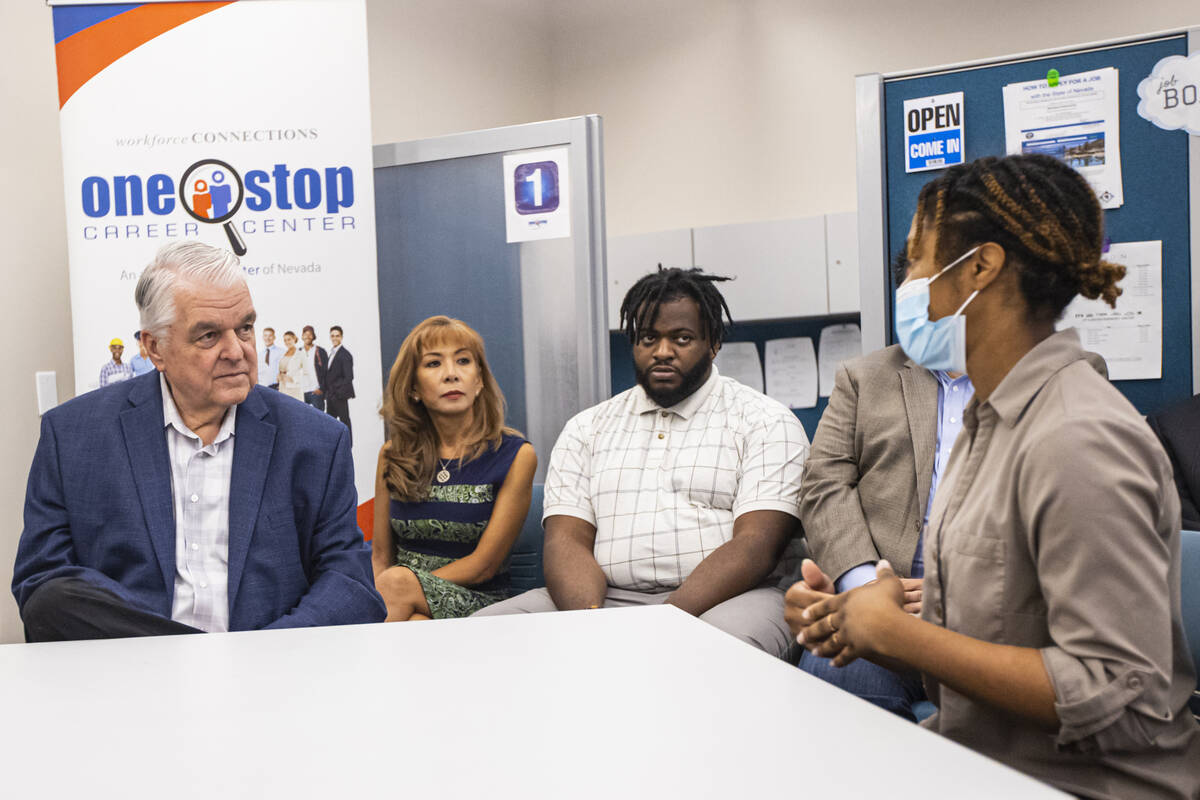 Gov. Steve Sisolak, left, talks with Aniya Fladger, youth career counselor at One-Stop Career C ...