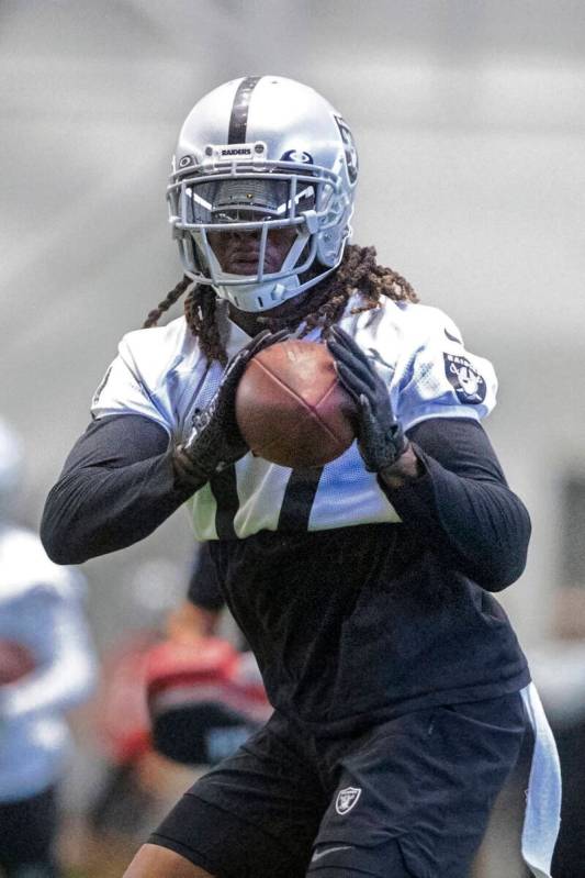 Raiders wide receiver Davante Adams (17) makes a catch during the team’s training camp p ...