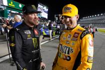 Kurt Busch, left, and Kyle Busch talk on pit road during qualifying for the NASCAR Daytona 500 ...