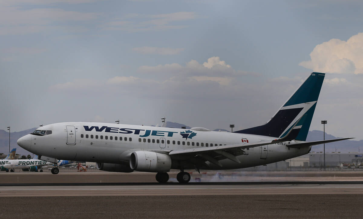 A WestJet plane lands at Harry Reid International Airport on Tuesday, July 26, 2022, in Las Veg ...