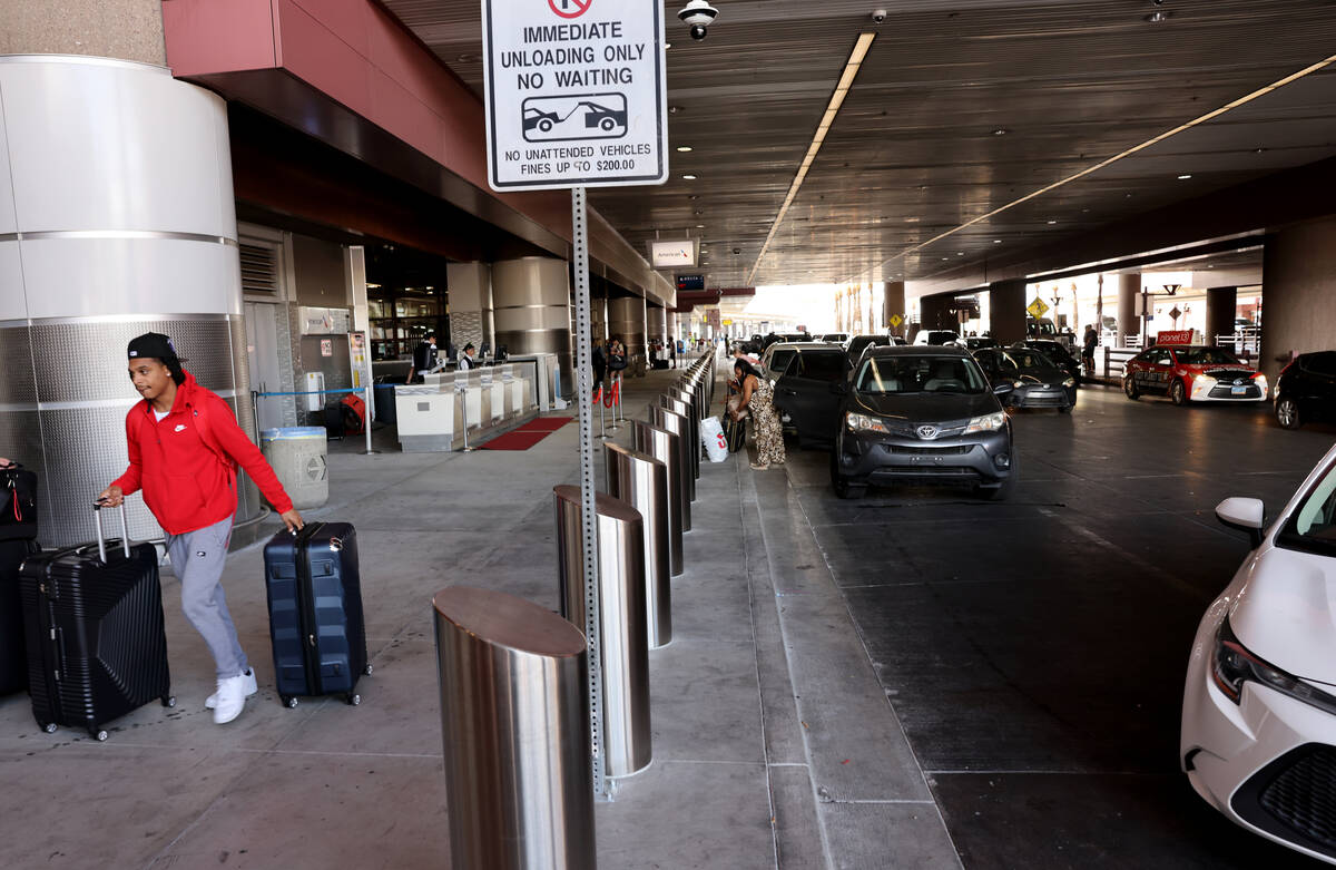 Newly installed traffic safety bollards along the check-in curb at Terminal 1 at Harry Reid Int ...