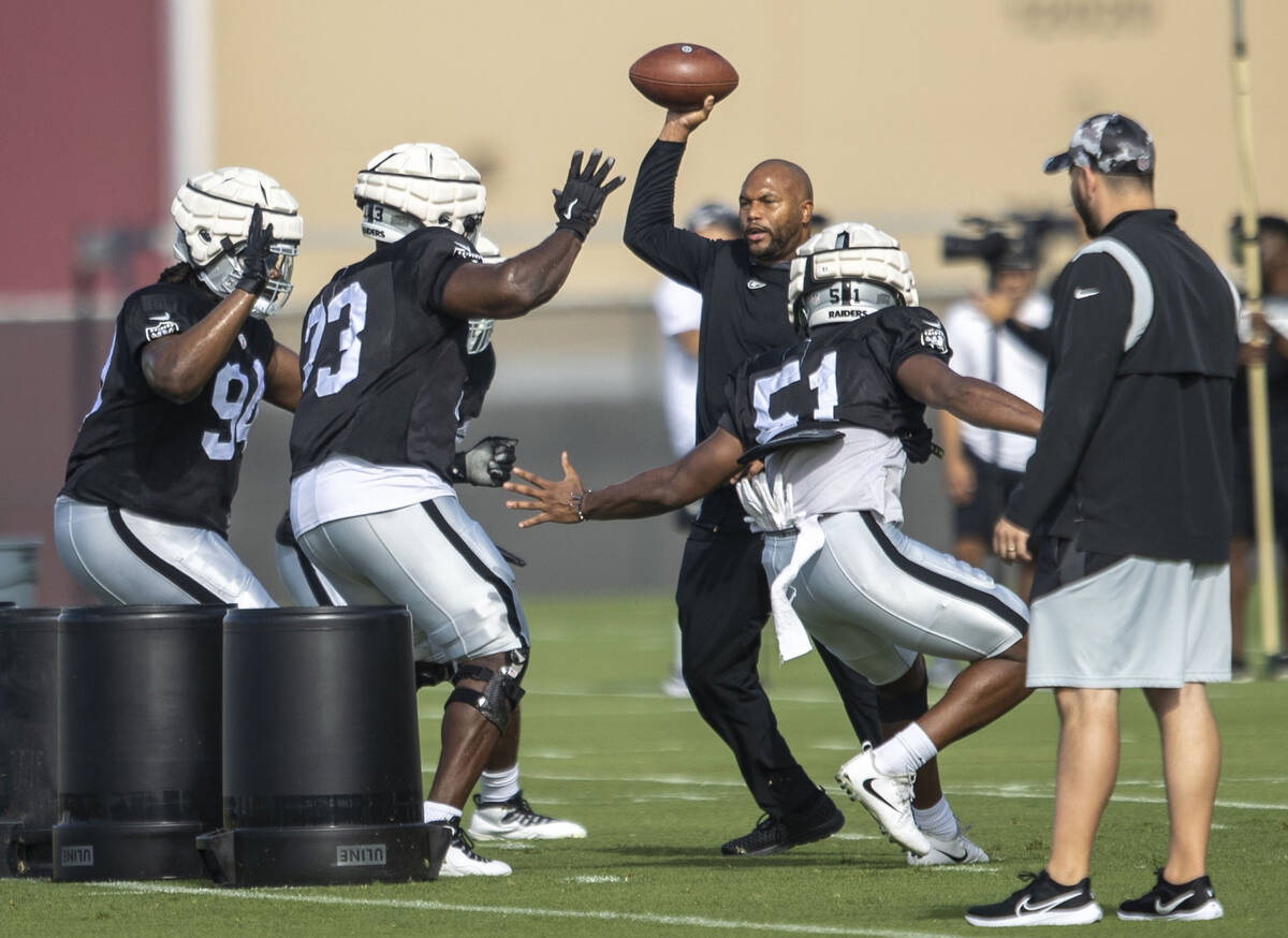 Raiders defensive linemen Vernon Butler (94), Matthew Butler (73) and Malcolm Koonce (51) work ...
