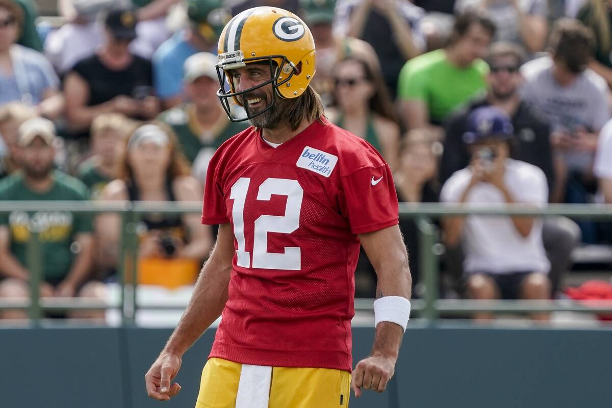 Green Bay Packers' Aaron Rodgers watches a drill at the NFL football team's practice field Wedn ...