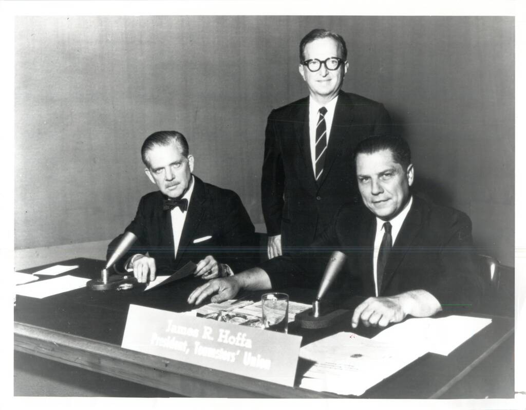 Jimmy Hoffa, seated next to moderator Ned Brooks, with Lawrence E. Spivak (standing) during an ...