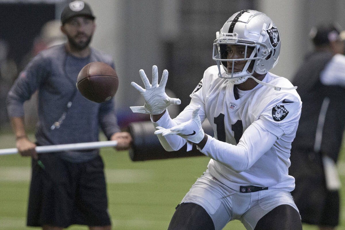 Raiders wide receiver Demarcus Robinson (11) makes a catch during the team’s training ca ...