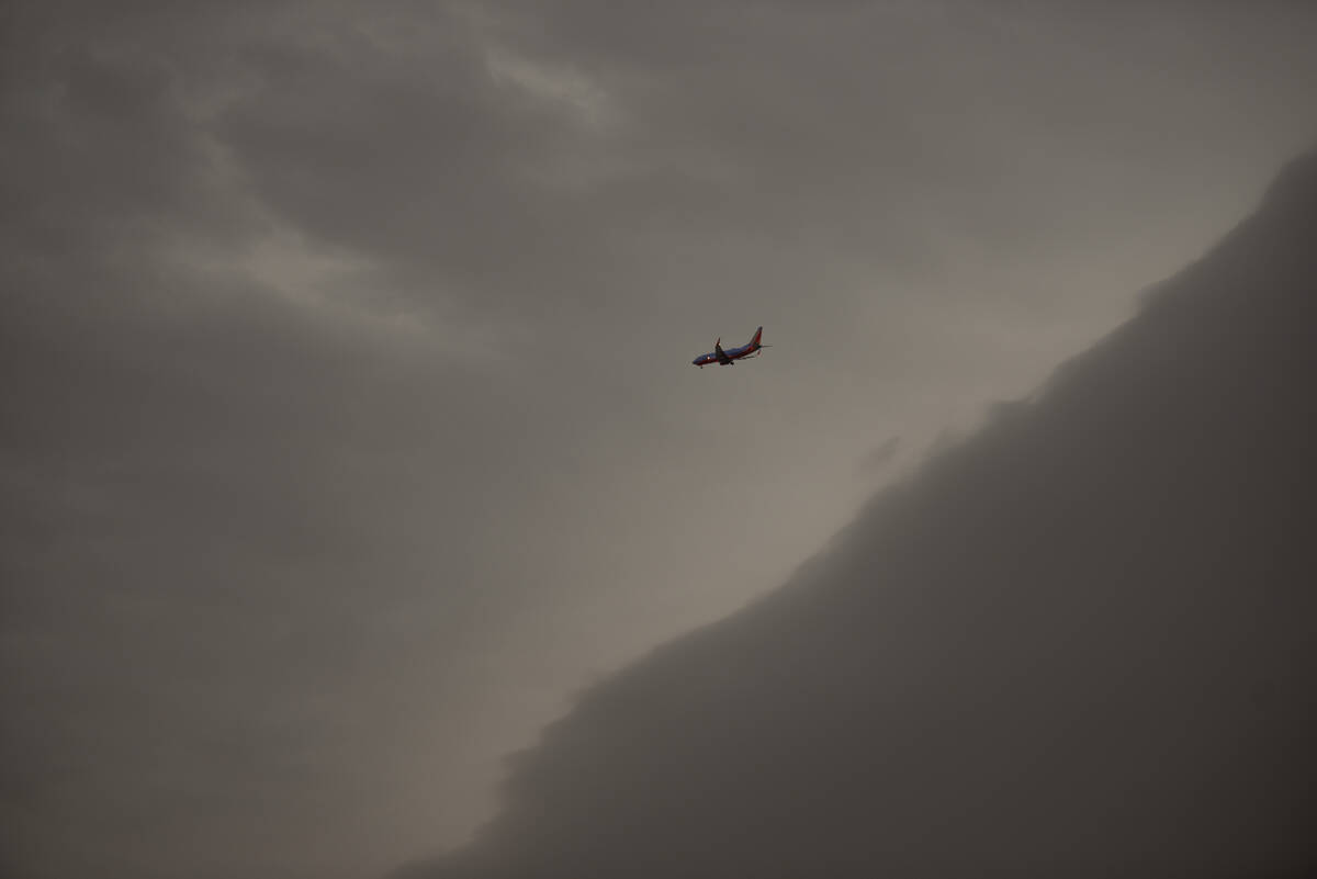 A Southwest Airlines plane flies toward Las Vegas during a storm on Wednesday, July 27, 2022. ( ...