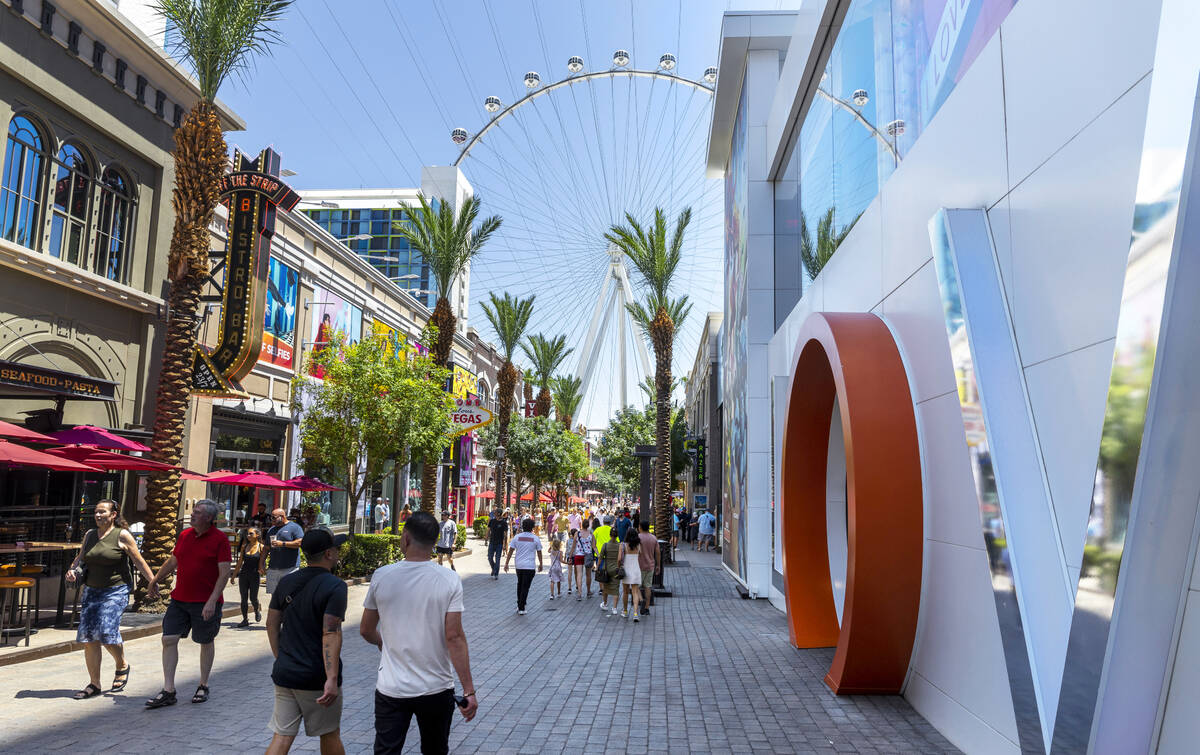 Visitors walk along The LINQ Promenade as gambling numbers are up on Thursday, July 28, 2022, i ...