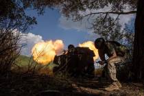 A Ukrainian self-propelled artillery shoots towards Russian forces at a frontline in Kharkiv re ...