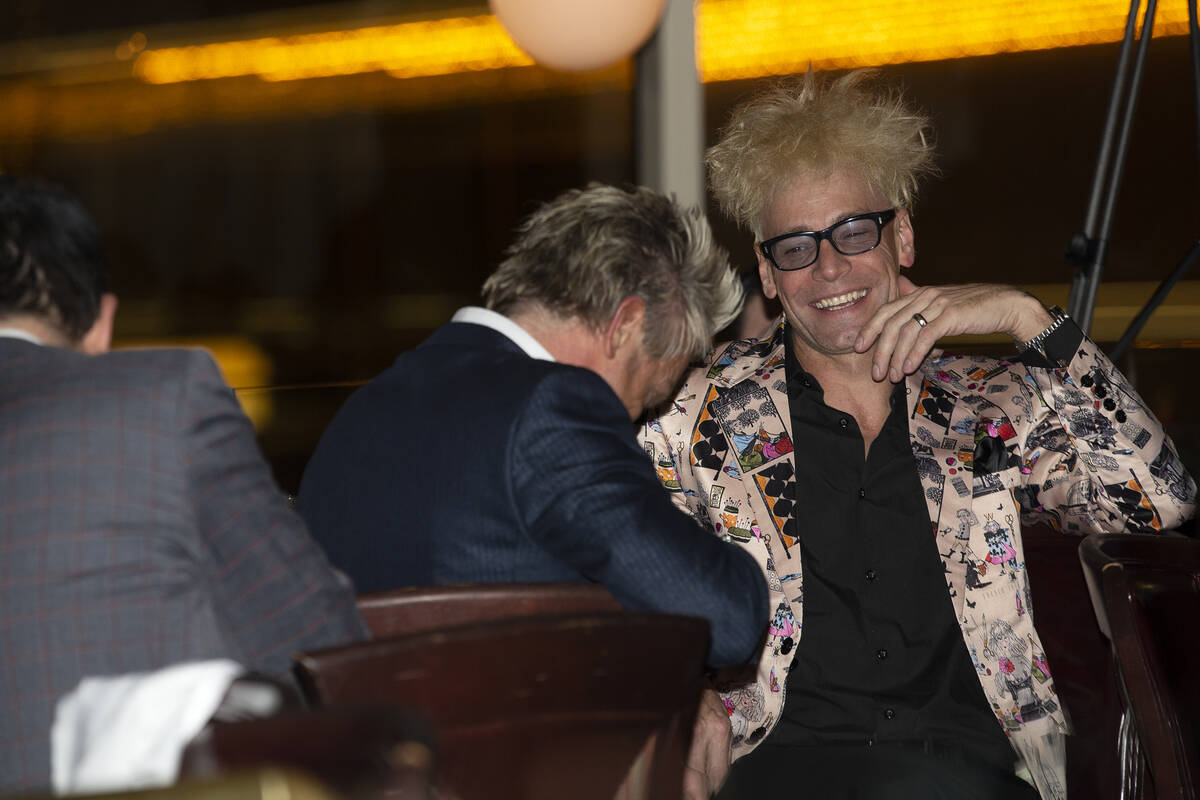 Magician Murray Sawchuck laughs with Zowie Bowie during a roast of former Las Vegas mayor Oscar ...