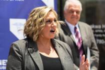 File - State Majority Leader Nicole Cannizzaro speaks as Gov. Steve Sisolak looks on, on Wednes ...